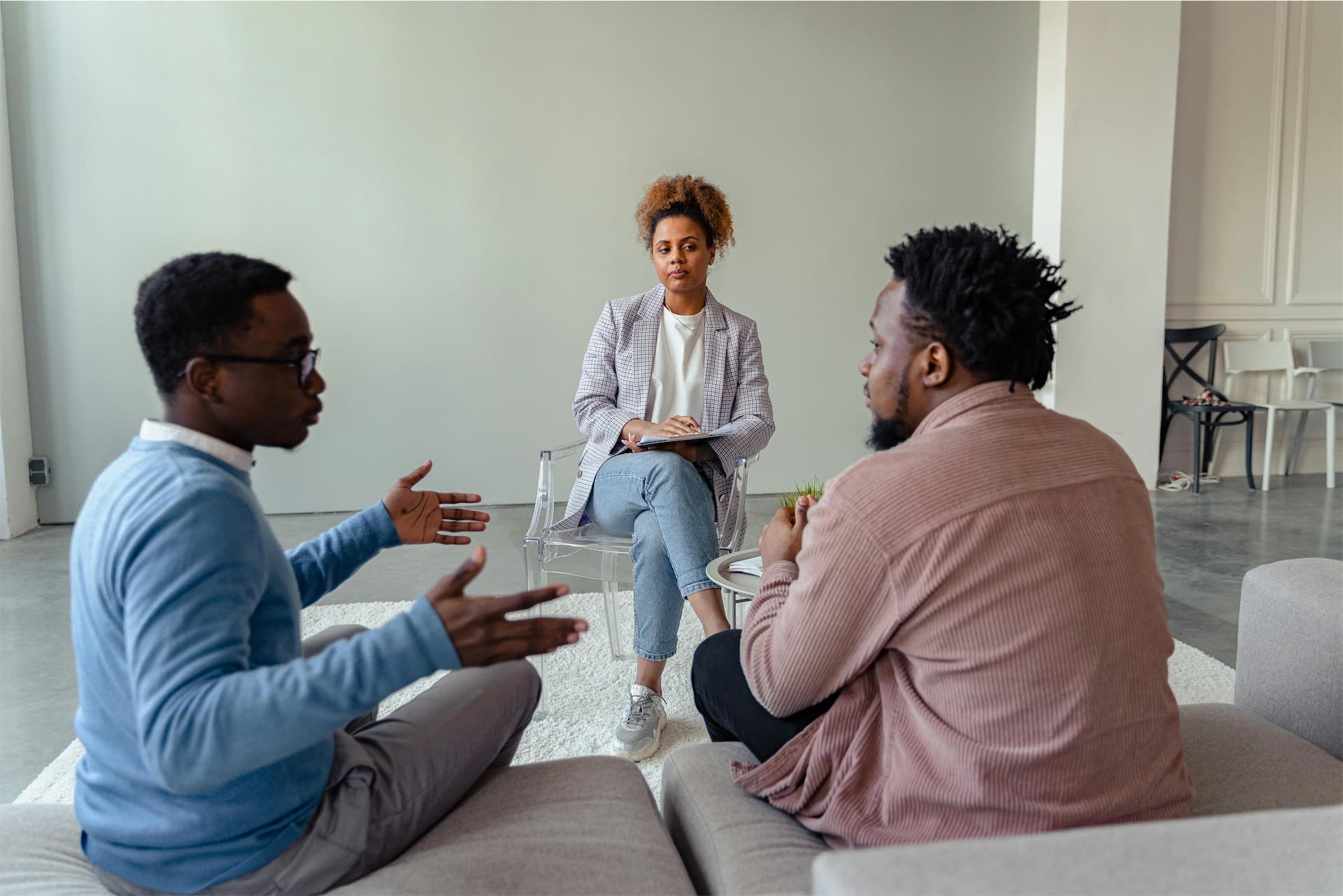 A mediator and two people talking